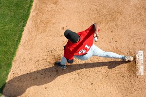 Baseball pitcher throwing ball 