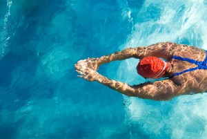 Picture of a person swimming in a pool.