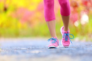 Picture of a woman walking on a trail.